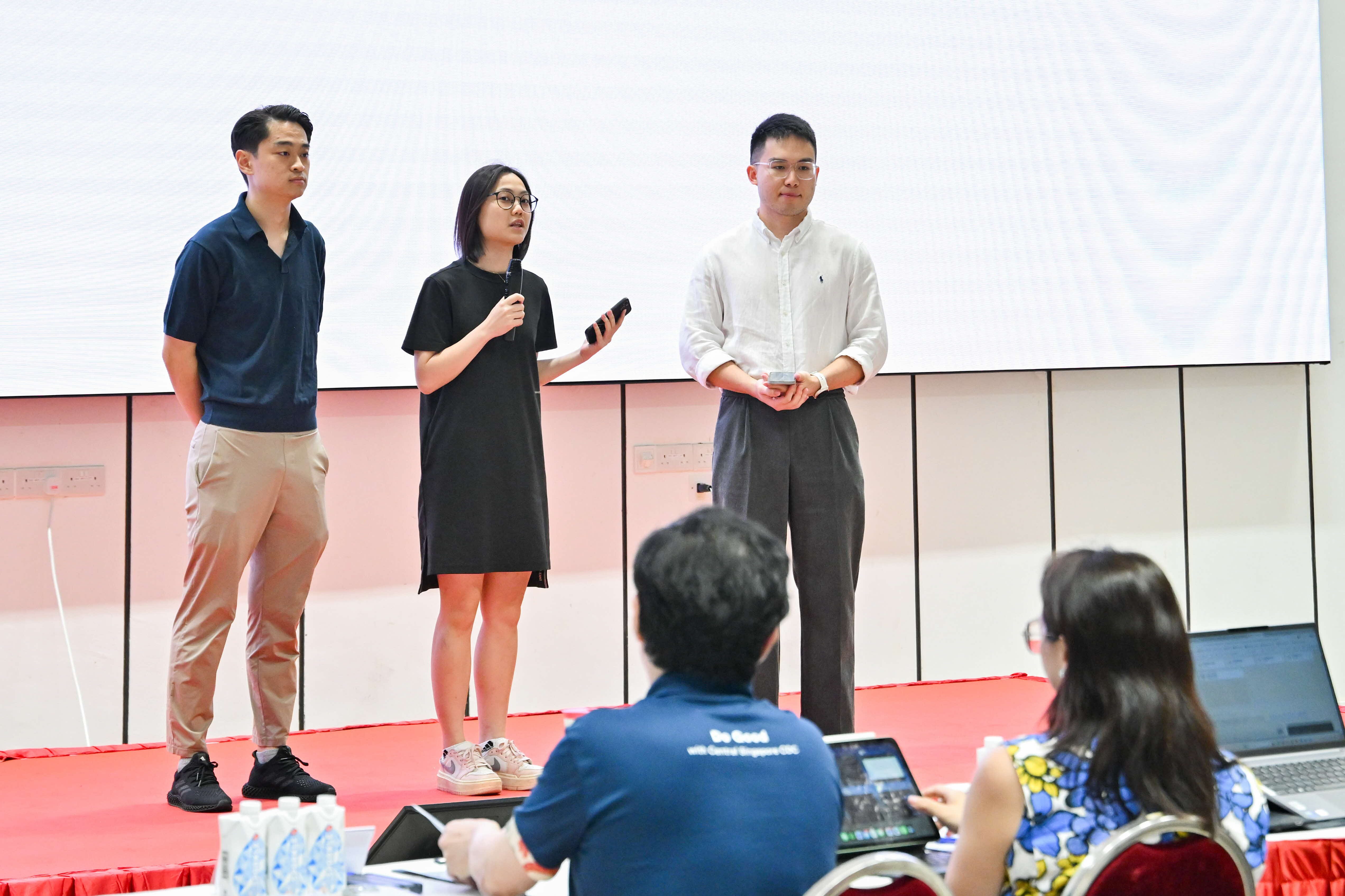 Three group members presenting to the panel